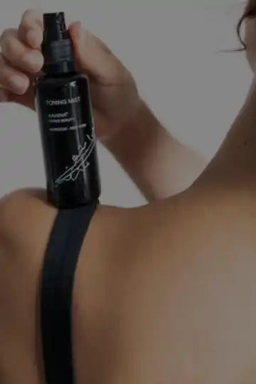 Black spray bottle with a sleek design.